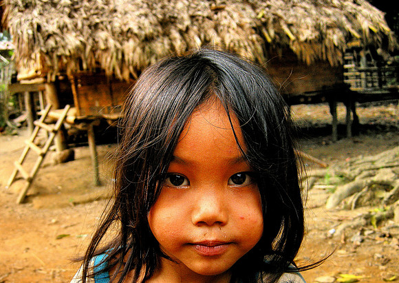 Girl and hut; Ban NaKaang, Laos, 2009