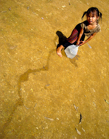 Girl with water; Ban NaKaang, Laos, 2009