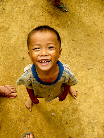 Boy surrounded; Ban NaKaang, Laos, 2009